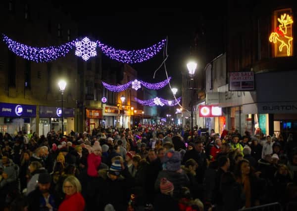 Crowds gathered in High Street, Falkirk to watch the town's Christmas lights being switched on. Picture: Scott Louden