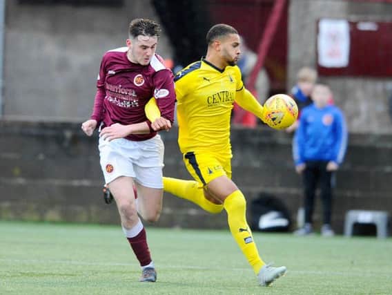 Falkirk player Dennon Lewis in yellow (picture: Michael Gillen)