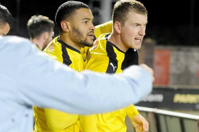 Harrison and Dennon Lewis re-emerge from the crowd after celebrations... (Michael Gillen)
