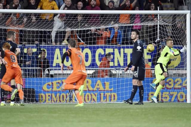 Dixon rose above Tom Taiwo to nod Dundee United ahead in the play-off semi-final and win 4-3 on aggregate.
