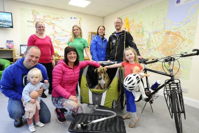 Local support...Ishbel's World Bike Girl blog has thousands of followers and she also has plenty of support in her chosen home town, Falkirk. She's pictured here at the town's Travel Hub, introducing visitors to her dog Maria, a street dog she brought home from Brazil and nurtured back to good health. (Pic: Alan Murray)