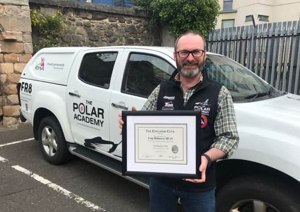 Pinnacle of success...Craig Mathieson with the Explorers Club certificate he received after being invited to join the illustrious club earlier this year.