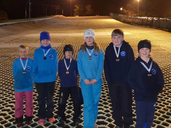 Six young skiers who train at Polmonthill Ski Centre entered as a team in the Blues League at Glasgow Ski and Board Centre, Bellahouston. This year was the 30th anniversary of this competition and the first time that Polmonthill had entered. The youngsters finished a very credible third place and picked up a bronze medal each. The children also ski as part of the Linlithgow Cluster Ski Club and for their schools which are Linlithgow Academy, Low Port Primary and the SSSA P1-4 Dual Slalom Champions Torphichen Primary.  The children will be back in action on their skis for the Boyd Anderson Trophy which will be held at Hillend on the 10th and 12th of December.  Left to right: Marcus Miller; Lexi Maxwell; Martin Miller; Nuala Maxwell; Gordon Maxwell; Alexander Fox- Roberts