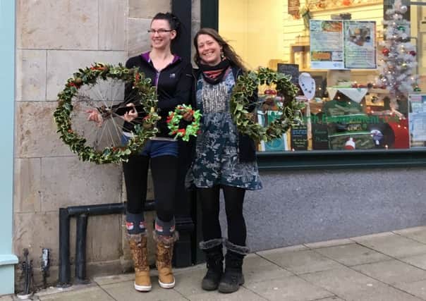 Norelle Calder McPhee and Sarah Fraser with examples of the wreaths theyll be making tomorrow