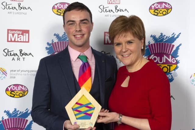 Jordan Daly receives awards - and congratulations - from First Minister Nicola Sturgeon.