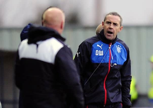 Ex-Falkirk defender and then Rangers assistant Davie Weir had words with the Bairns bench. Picture Michael Gillen