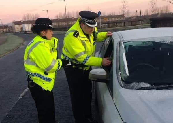 Chief Inspector Damian Armstrong assisted Falkirk community police officers in carrying out roadside breath tests. Picture: Police Scotland