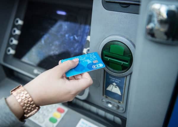 Police are warning shoppers to look out for card-skimming devices on ATMs