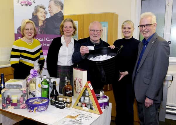 Patron Dennis Canavan conducting The Driving Forces Grand Christmas Prize Draw alongside (L to R) fundraiser Charlotte Campbell, founder Dr Bridget McCalister, fundraiser Karen Coyle and chairman David McMillan. Picture: Michael Gillen