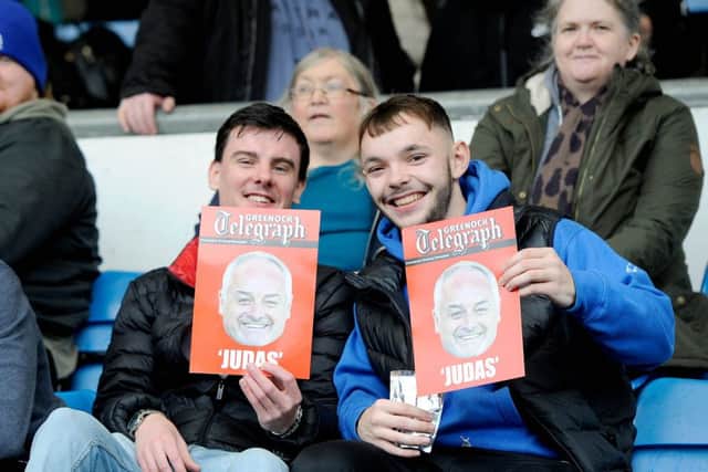 The local newspaper produced red cards to demonstrate against the former Greenock boss. Picture Michael Gillen.