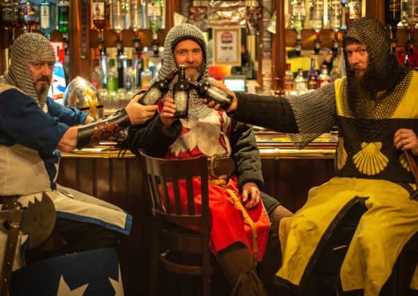 A great knight beckons at the Tolbooth Tavern as the heritage trio prepare to sample the first of three Sir John de Graeme ales.  Picture courtesy Scotdrone.