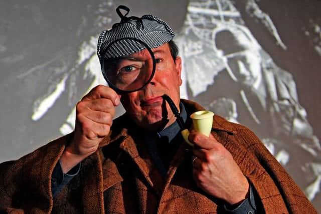 Musician Mike Nolan dressed as Sherlock Holmes after performing a short extract from his new accompaniment composed for the UK Premiere of the restoration of Hound of the Baskervilles (1929)  based on the much-loved Conan Doyle novel.