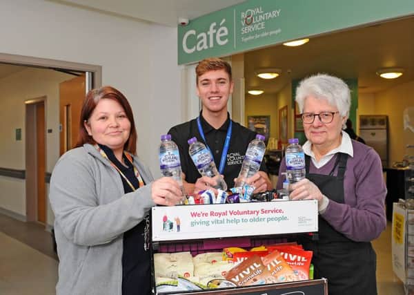 Appeal...Lorna Stevenson (left) hopes more people will join the ranks. She is pictured with service assistant Shane McCann and volunteer Lesley Leishman. (PIc: Michael Gillen)