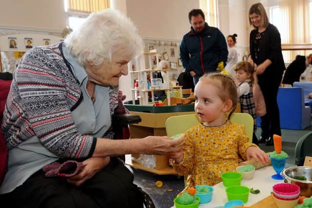Inter-generational play...Dora Bryant (87) happily plays with a nursery pupil. She is one of many Airthrey Care Nursing Home residents who enjoys popping in to see the pupils, in addition to their regular visits to the home. (Pic: Michael Gillen)