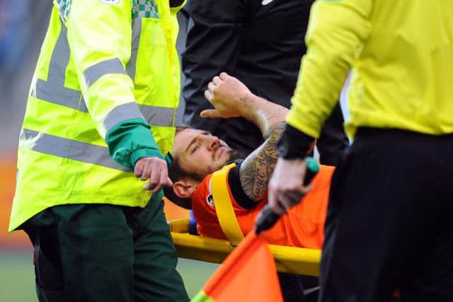 The stretcher was required twice for United players. Frederic Frans weas first to be taken off. Picture Michael Gillen.