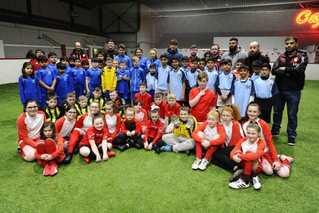 Children showed great sportsmanship at the first Al Masaar community football tournament. Picture: Alan Murray