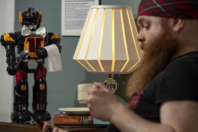 Robot butlers (left) and the return of Hillybilly beards are among VisitScotland's predictions for the country's tourism future.