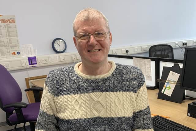 On hand to help...Robert Cameron, senior call handler in Falkirk, is one of nine CAB specialists working on Financial Health Check. He wants people who don't know what they're entitled to call the helpline today.