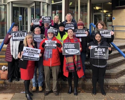 Protesters outside the budget meeting