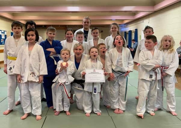 Jayne Clason celebrates winning British Judo Council coach of the year with her young pupils at Deanburn Judo Club in Grangemouth