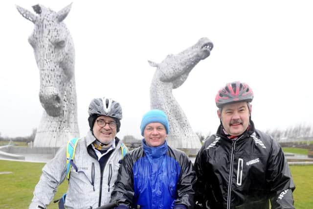 Taking in the view...Alan, George and Andy enjoy some well deserved time out at the Kelpies. (Picture: Alan Murray)