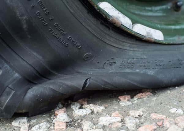 Montgomery's front tyre was running on the metal rim