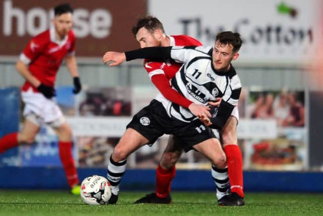 Jamie Gallagher and Mark McConnoll tussle during Shire's defeat. Picture: Michael Gillen.