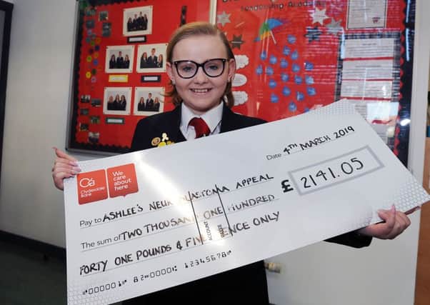 Ashlee with the latest cheque for her appeal - £2,141, all raised by staff and pupils at Braes High School.