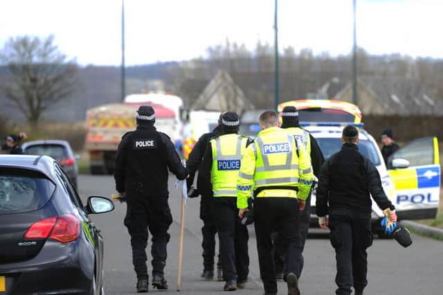 A nearby field is being searched.