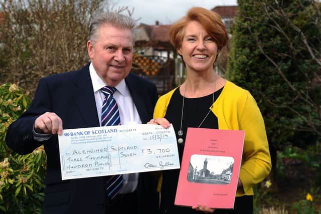 Alzheimer Scotland service manager Fay Godfrey was delighted to receive a bumper cheque from Alan Gillies for the charity