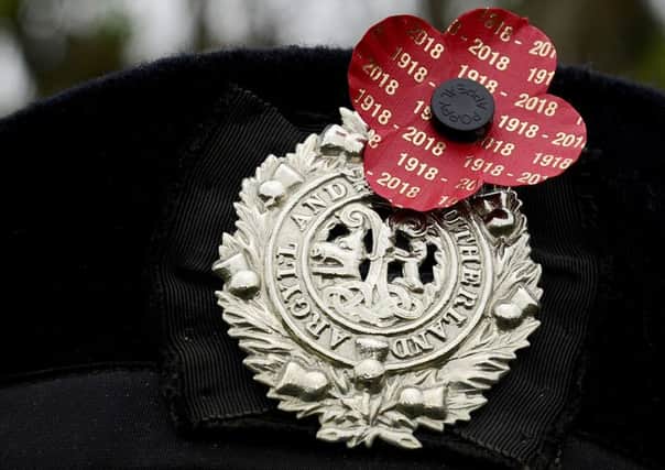 24-10-2018. Picture Michael Gillen. CAMELON Cemetery - graveside commemoration with veteran soldier Charles Stewart (78)l meet at cemetery gates. Remembering his grandfather, Willian Allan who died October 24, 1918. Argyll and Sutherland Highlanders regimental badge with Poppy Scotland Centenary Poppy.