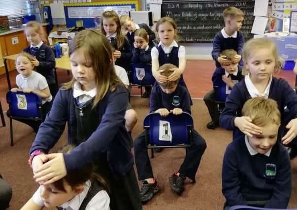 Shieldhill Primary School pupils get to grips with the Massage in Schools programme