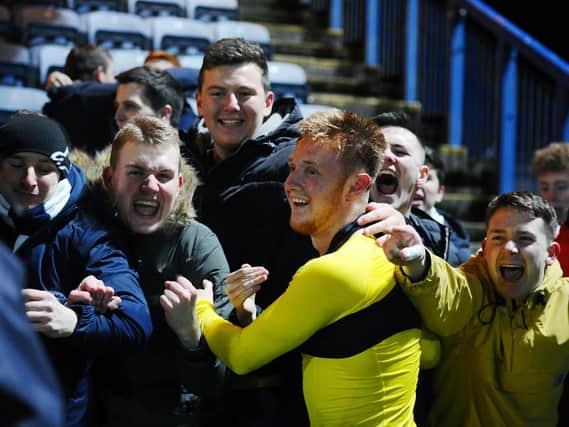 Falkirk penalty scorer Davis Keillor Dunn celebrates with the away fans. But he then received a second yellow card for taking his shirt off and was sent off (Pic by Michael Gillen)