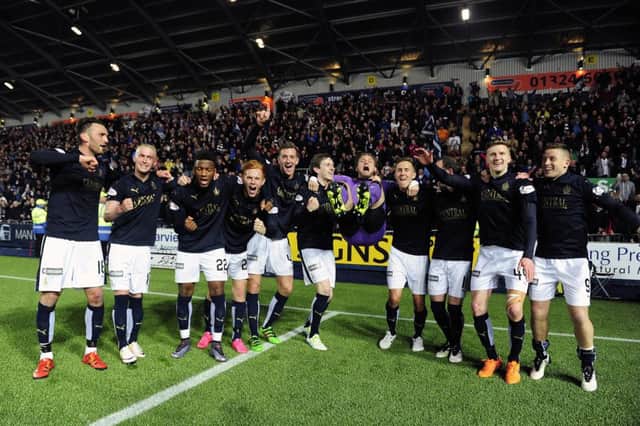 Falkirk players celebrate at end of game.