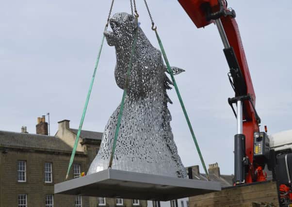 The maquettes have been used to promote Falkirk in many different location - in this picture one of the models is seen being winched into place in the Borders town of Kelso.