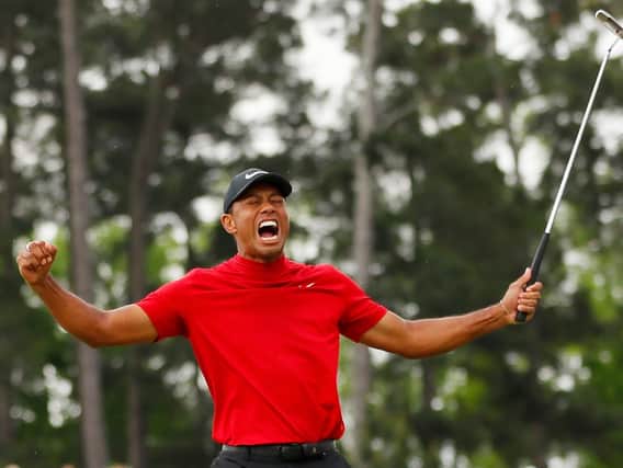 Tiger Woods celebrates after holing the putt that clinched the US Masters.