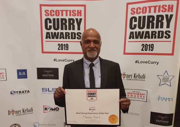 Ram Salhotra, owner of Masala Ram's, collects the Best Dining Experience of the Year title