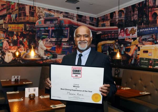 Masala Ram's owner Ram Salhotra proudly shows off the award