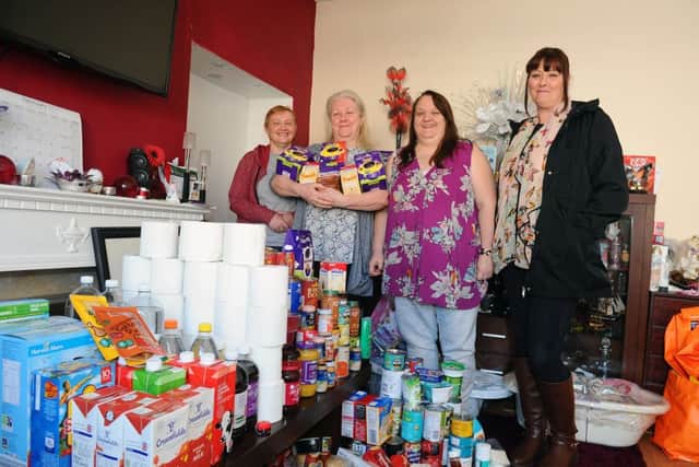 Linda Foster and Jackie Queen with representatives from Roots Helping Hands Food Share, Sheralee Maxwell and Lorna McPherson