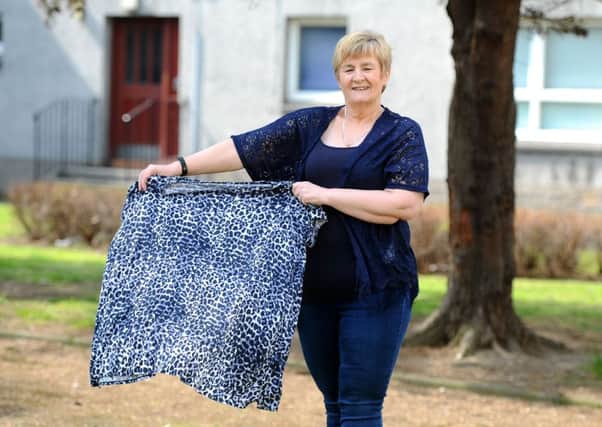 New look...Margaret Stewart, with the t-shirt she wore to her first class, has lost more than four and a half stone in little more than a year thanks to WW. (Pic: Michael Gillen)
