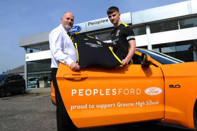 18-04-2019. Picture Michael Gillen. SFFH_190271  MG  12.30pm. FALKIRK. Grahams Road. Peoples Ford Falkirk. Graeme High School footballers preview pics ahead of Scottish Schools Shield Final. Peoples Ford Falkirk are the shirt sponsors. George Renwick, sales manager and Jamie Scott, captain.