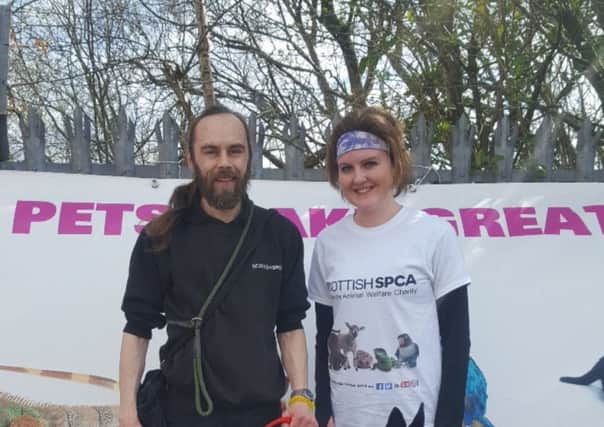 Louise Campbell with Scottish SPCA assistant manager, Alan Grant