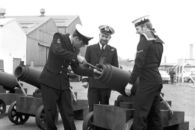 Petty Officer Wheelan loading one of the replica carronades (a light cannon) - also in picture Lieutenant Commander K Kempsall and Seaman J Mckenzie.