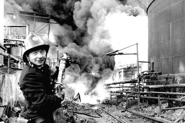 A fireman tackles the blaze at the Scottish Tar Distillers' plant at Camelon near Falkirk in November 1973.