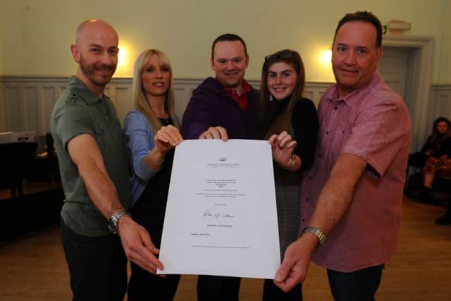 Larbert Amateur Operatic Society members proudly show off their letter from Andrew Lloyd Webber. Picture: Michael Gillen