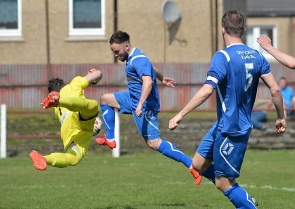 Fraser Keast (Bo'ness) beats Haris Alysandratos (Tranent keeper) for the first goal.

(pic) Dave Johnston