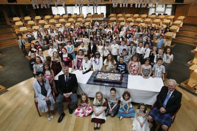 Presiding officer Alex Fergusson and deputy presiding officers Trish Godman and Alasdair Morgan are pictured with the July 1, 1999, babies who visited Parliament for its 10th birthday. It is hoped they will return for the 20th celebrations. (Pic: Adam Elder)