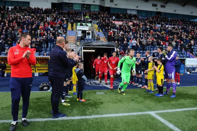 Falkirk provided a guard of honour for league champions Ross County - and were relegated two hours later.
