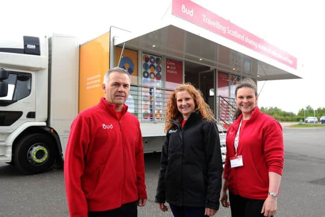 All aboard...the team setting up at Falkirk FC Stadium on May 4 (from l-r) Bud driver Colin Telfer, deputy head of learning and outreach Kerry Crichton and learning and outreach officer Catherine Provan. (Pic: Michael Gillen)