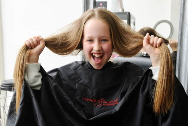 10-05-2019. Picture Michael Gillen. FALKIRK Tweedie and Marshall, 46-48 Vicar Street, Falkirk, Fk1 1JB. Young girl Layla Ruthiewicz (9) getting a sponsored hair cut for Strathcarron Hosice, with hair going to Little Princess Trust.